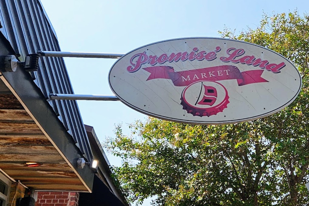 Best Bars In The Crystal Coast Area - Promise' Land Market Sign